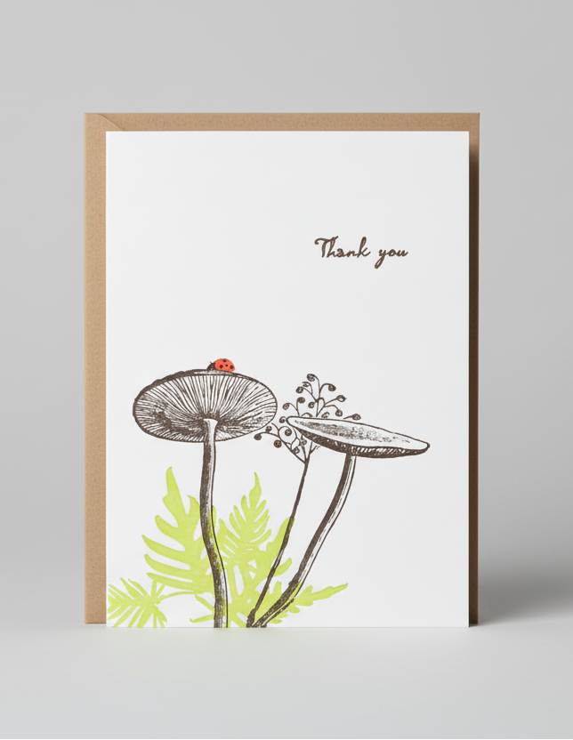 Greeting card with mushroom illustration and 'Thank you' text on a white background