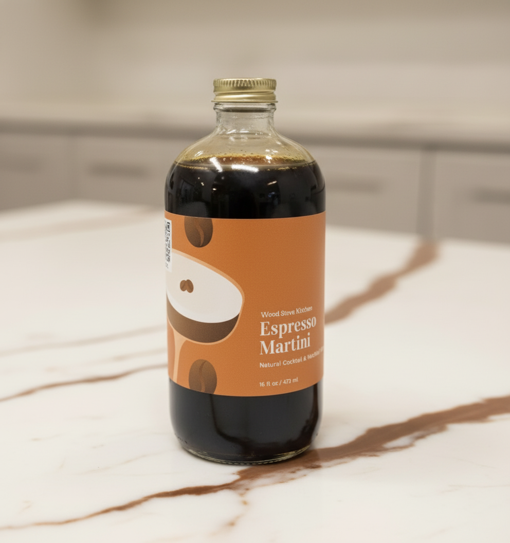 A bottle of Espresso Martini Mixer with a white and brown label, 16 oz size, on a white background.
