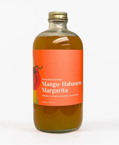 A bottle of Mango-Habanero Margarita Mixer with a label showing the product name and a hint of a chili pepper illustration.