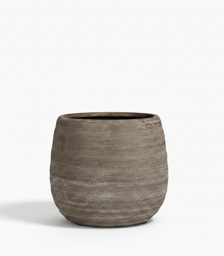 Textured brown pot on a white background