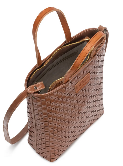Brown woven handbag with leather straps on a white background
