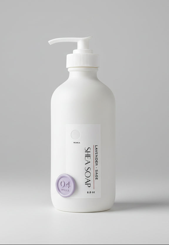 Shea soap bottle with pump on a wooden surface