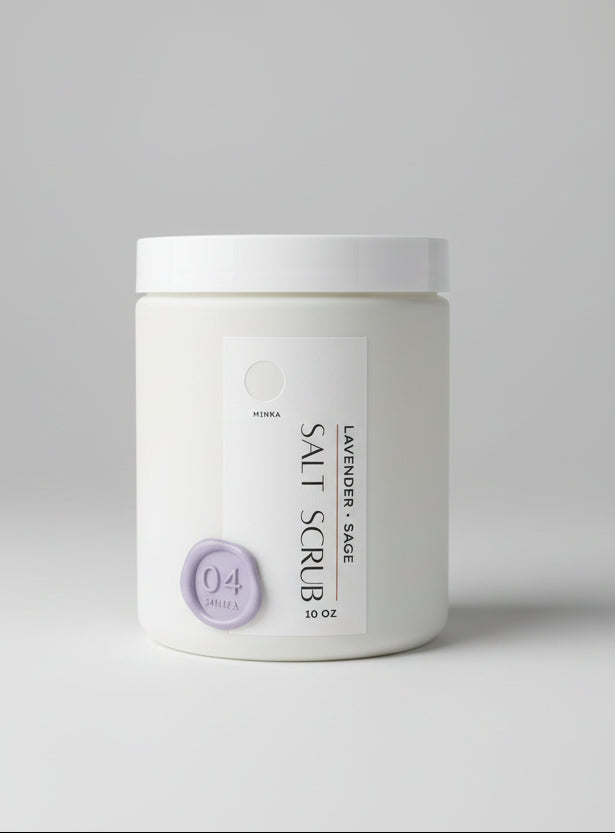 Container of lavender sage salt scrub on a wooden surface