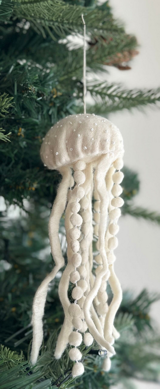 Decorative jellyfish ornament hanging on a Christmas tree.