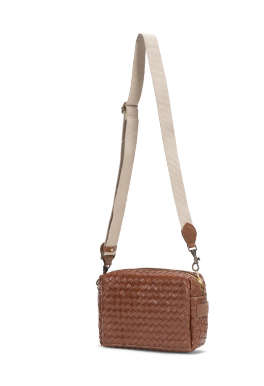 Brown woven handbag with beige strap on a white background
