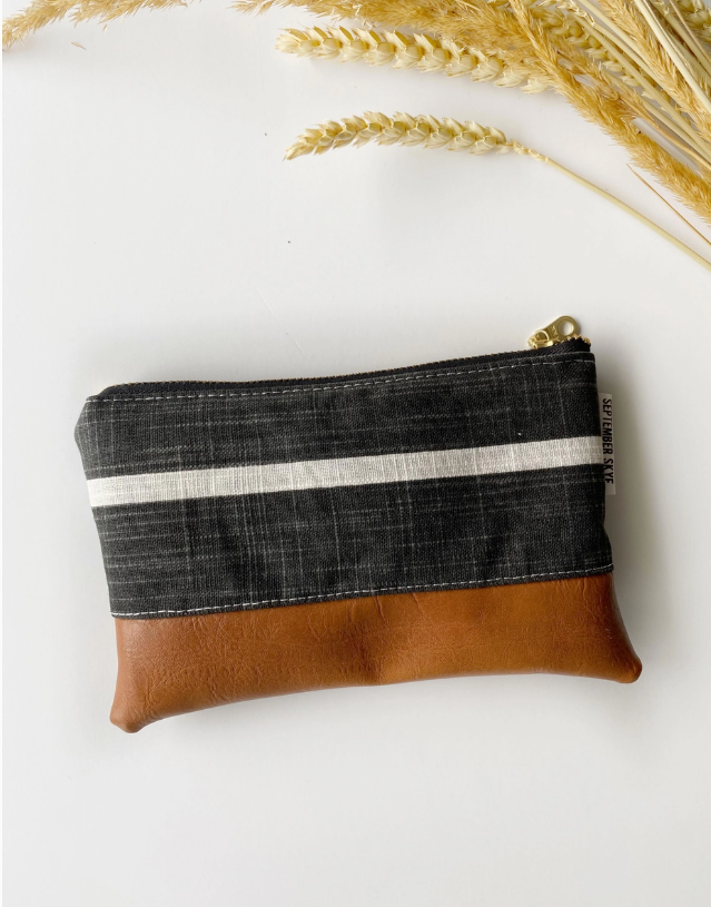 Small pouch with black and brown design on a white background