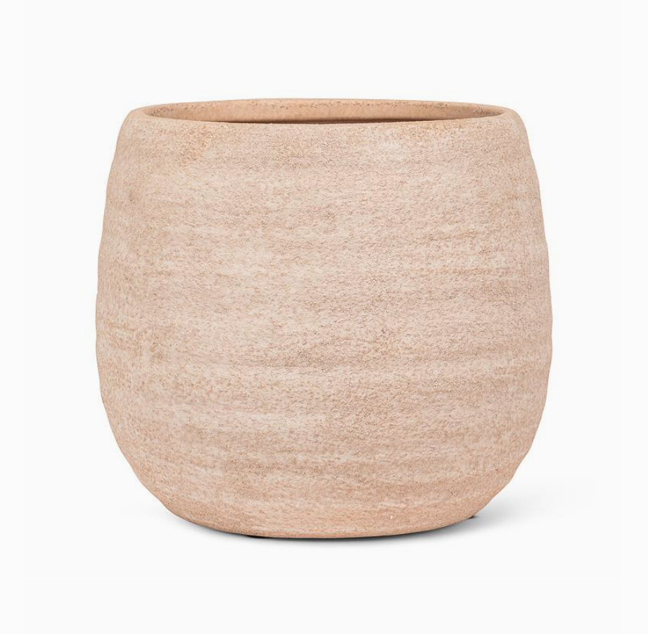 Beige ceramic pot on a white background