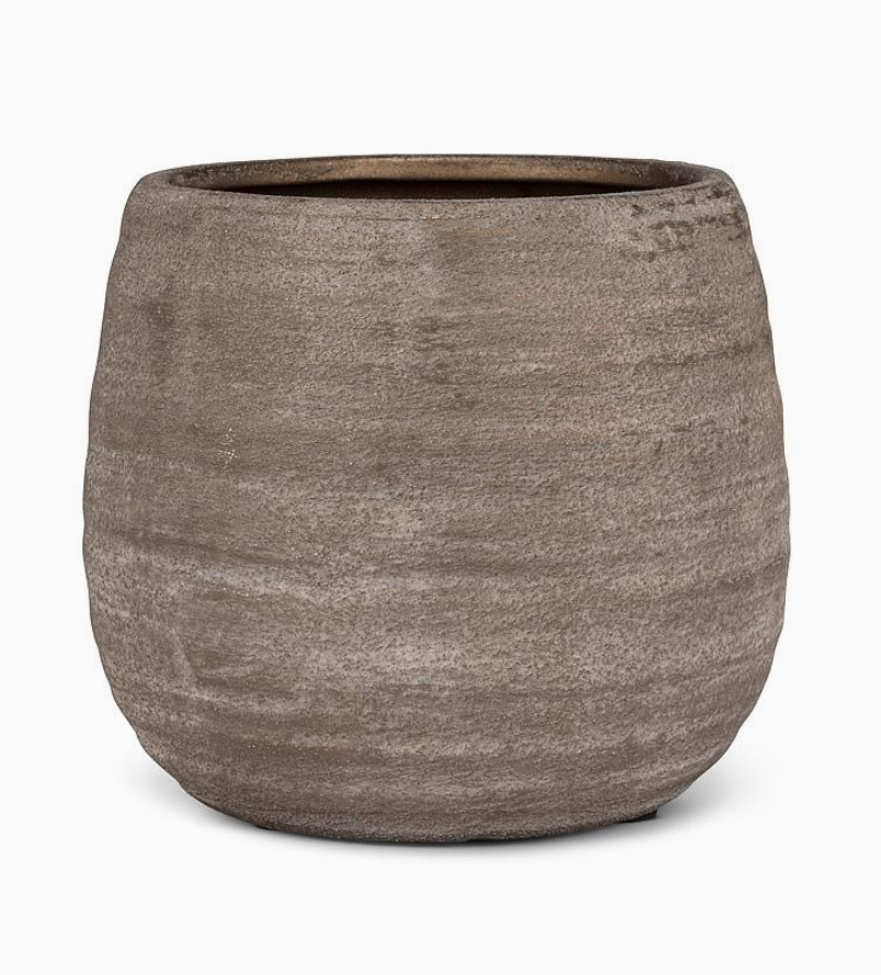 Textured brown pot on a white background