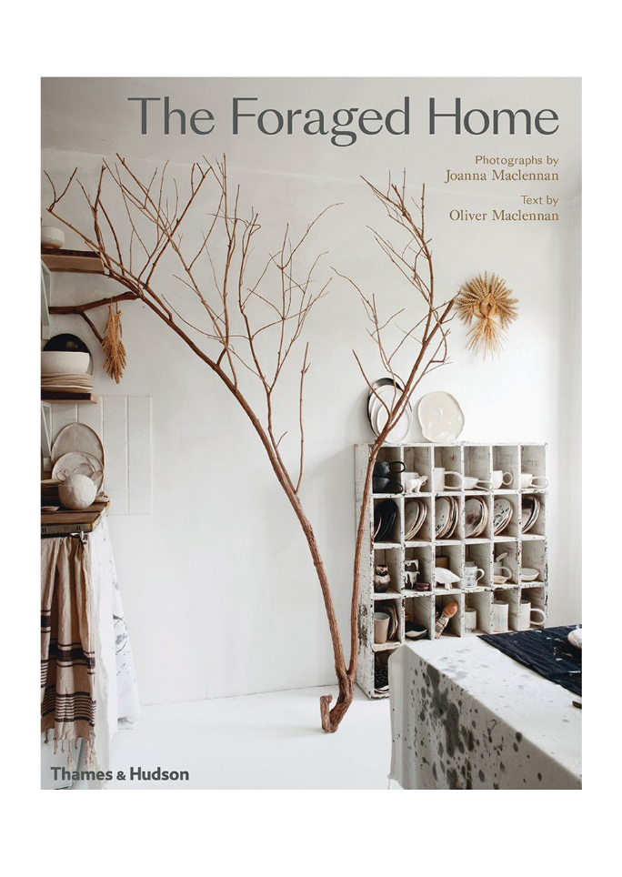 Book cover of 'The Foraged Home' with interior design elements and branches.