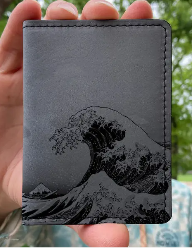 gray wallet with black wave print