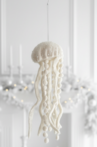 Decorative jellyfish ornament hanging against a white background