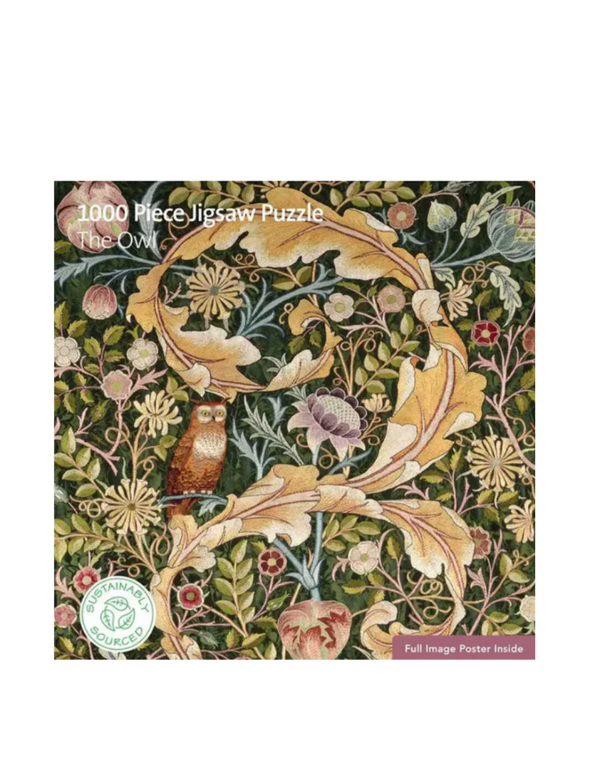 Jigsaw puzzle packaging with an owl design and 'The Owl' text on a white background