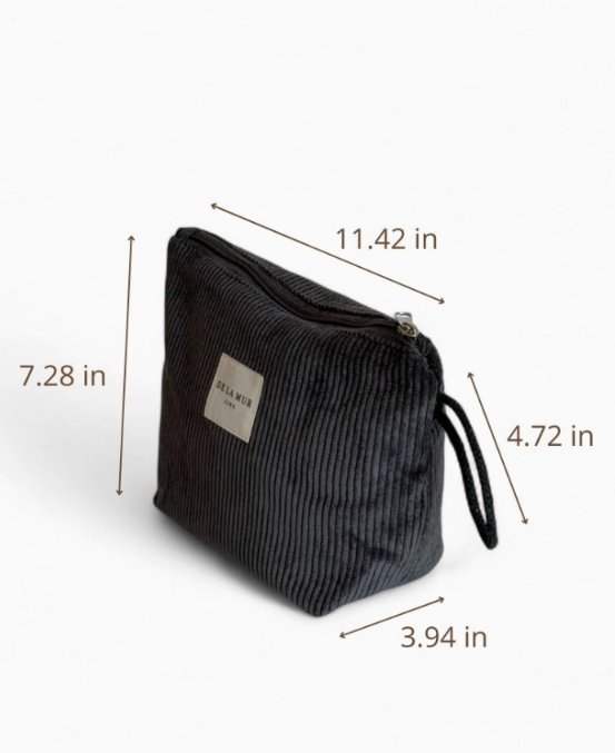 A dark gray corduroy zippered pouch with dimension lines and measurements (11.42 in, 7.
