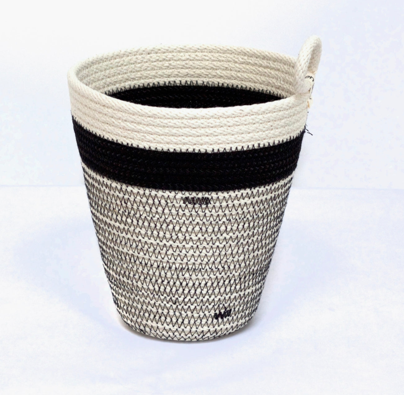 Black and white striped woven basket by Woven Grey