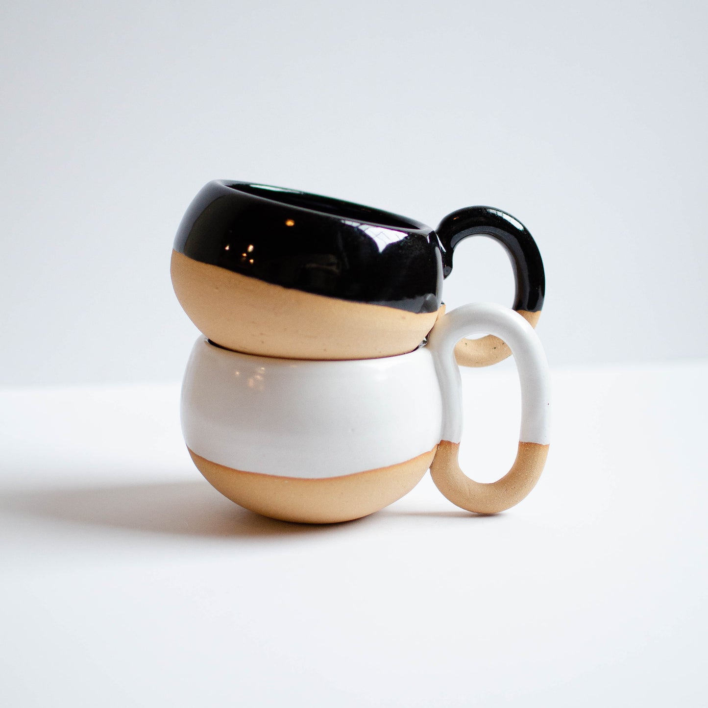 handmade in maine ceramic mug. black and white